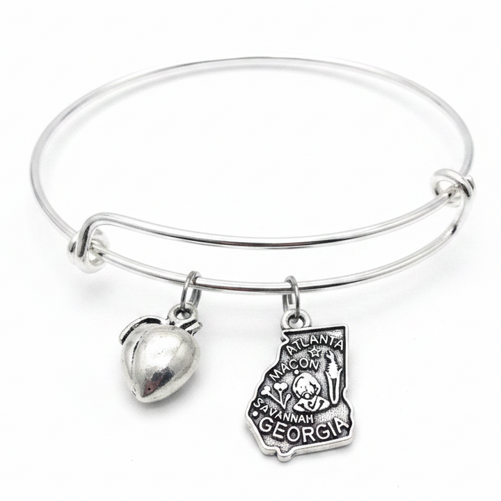 Silver expandable bangle bracelet with two charms: puffy silver heart charm and detailed Georgia state shape charm engraved with Atlanta, Macon, Savannah and Georgia landmarks — adjustable stackable gift bracelet for Georgia lovers and women