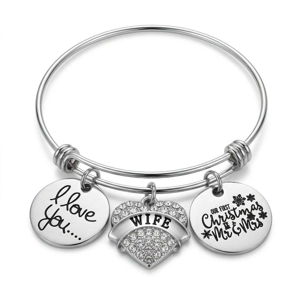 Stainless steel bangle with silver-plated I Love You disc, crystal Wife heart, and Our First Christmas as Mr and Mrs charm on white.