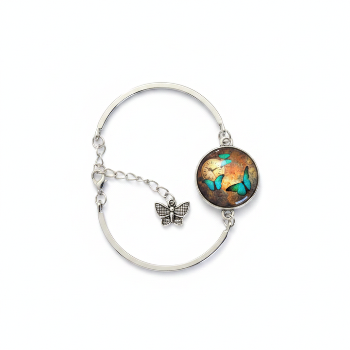 Teal morpho butterfly and clock glass dome silver cuff bracelet with butterfly charm on white background – Jules Obsession