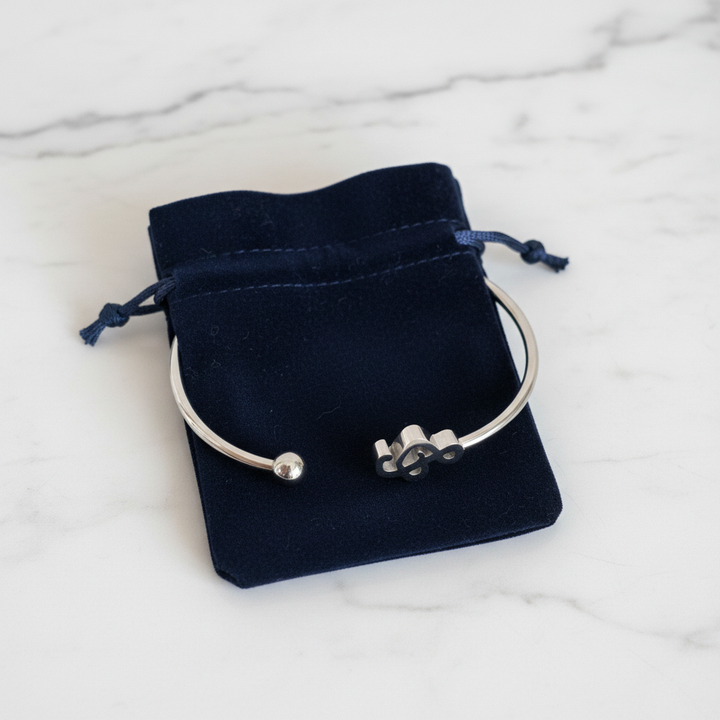 Treble clef music note cuff bracelet gift-ready in dark velvet jewelry pouch – stainless steel bangle by Jules Obsession