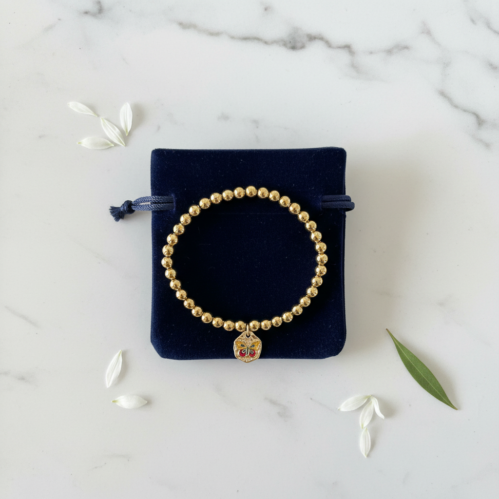 Gold bead butterfly enamel charm stretch bracelet gift-ready in dark velvet jewelry pouch – butterfly gift by Jules Obsession