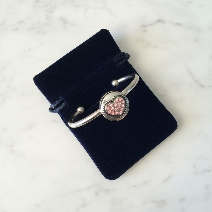 Pink crystal heart snap bracelet gift-ready in dark velvet jewelry pouch – surgical stainless steel cuff by Jules Obsession