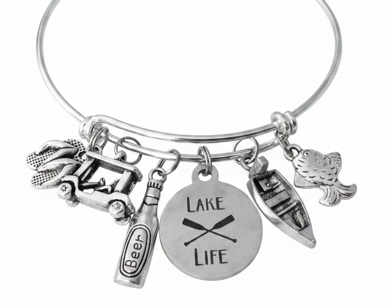 Lake Life expandable silver charm bangle bracelet featuring Lake Life engraved disc, jeep with kayak, beer bottle, canoe, and fish charms — Jules Obsession handcrafted jewelry, made in USA