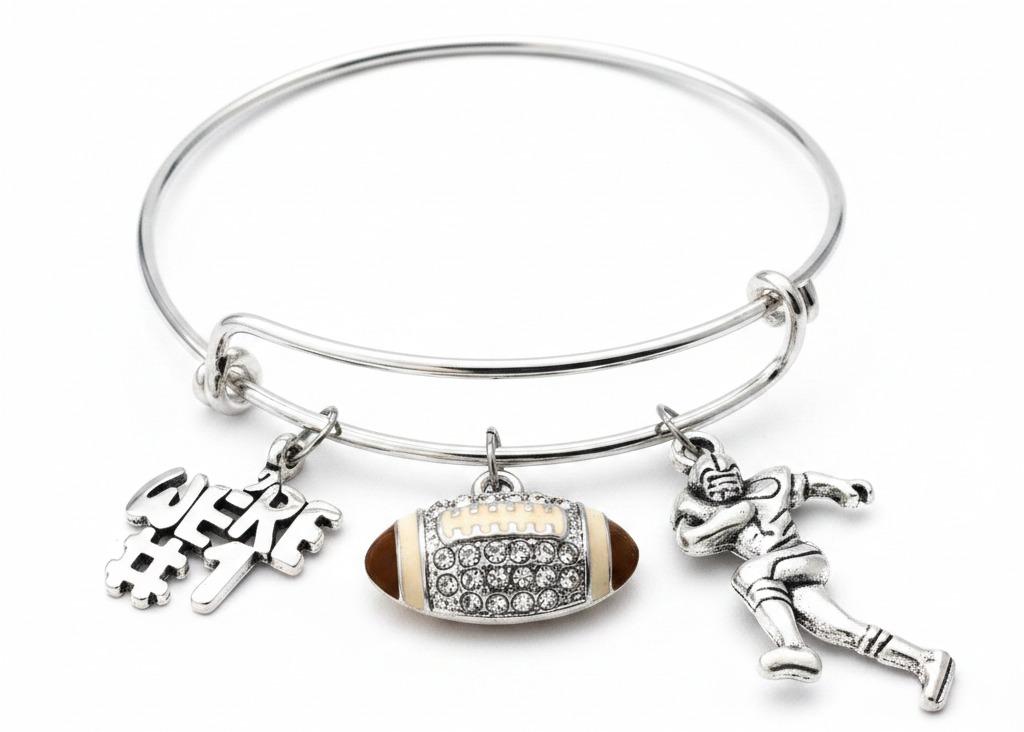 Silver expandable bangle bracelet with three football charms: We're #1 text charm, crystal rhinestone football charm, and silver football player charm on white background