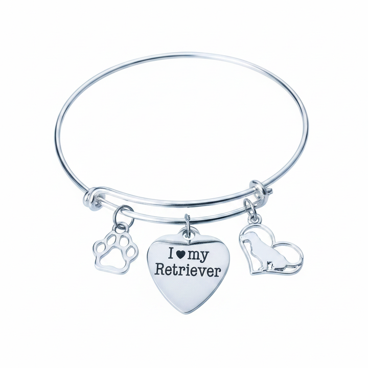 Silver expandable bangle bracelet with three charms: paw print cutout charm on left, heart charm engraved I love my Retriever in center, and dog silhouette inside heart charm on right
