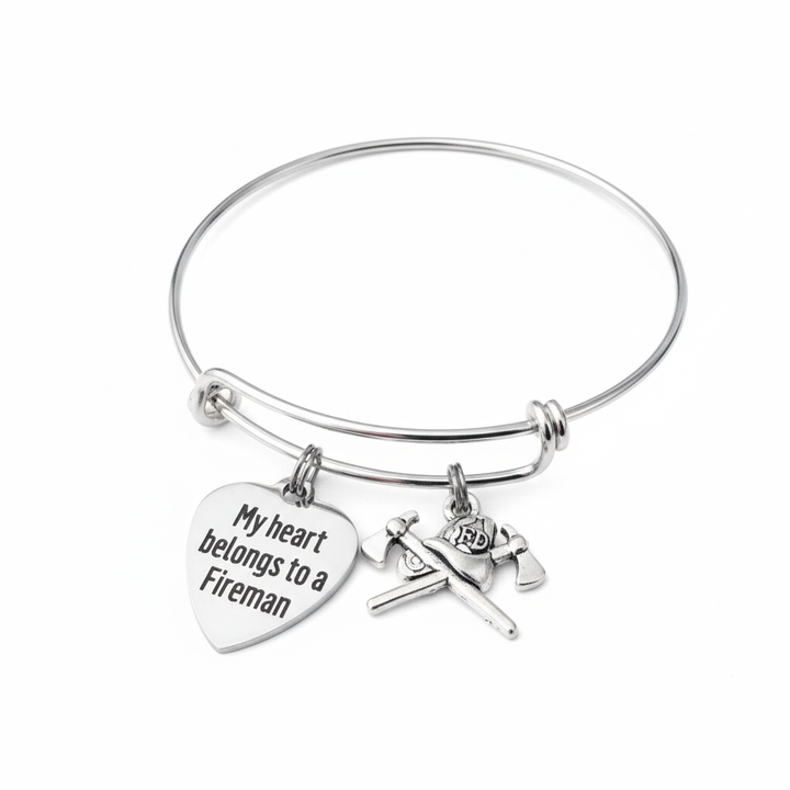 Silver expandable bangle bracelet with engraved My Heart Belongs to a Fireman heart charm and firefighter gear charm
