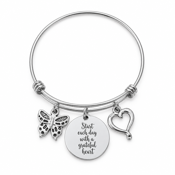 Stainless steel bangle bracelet with butterfly charm, engraved disc charm reading &