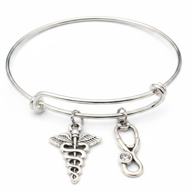 Silver expandable bangle bracelet with caduceus medical symbol charm and stethoscope charm on white background – Jules Obsession nurse and doctor gift jewelry