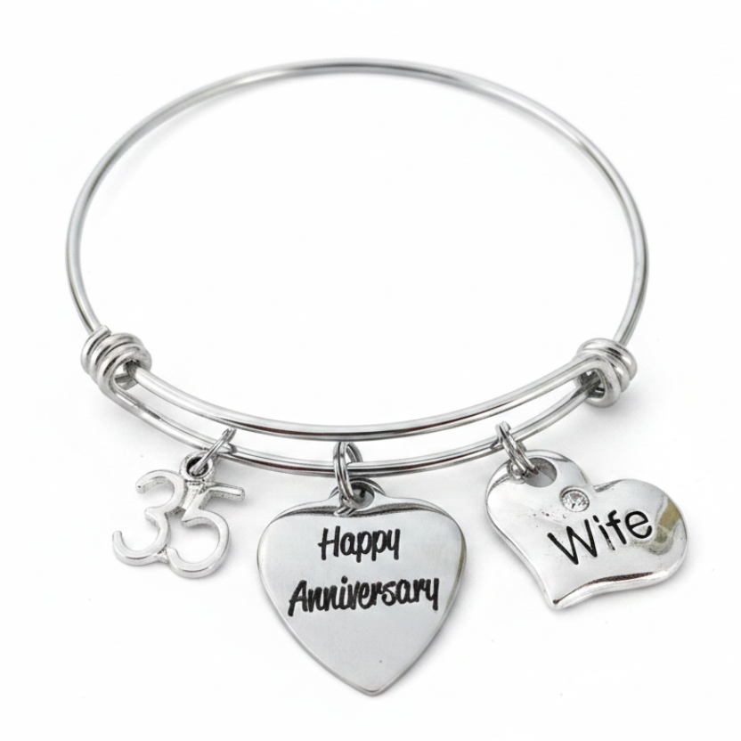 Silver expandable bangle bracelet with 35th anniversary charms — number 35, Happy Anniversary heart, and Wife crystal heart — on white background, handcrafted anniversary gift jewelry by Jules Obsession