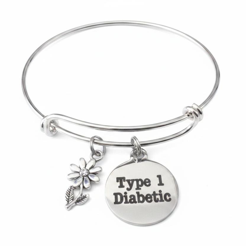 Silver expandable bangle bracelet with Type 1 Diabetic engraved disc charm and daisy flower charm with crystal center, on white background