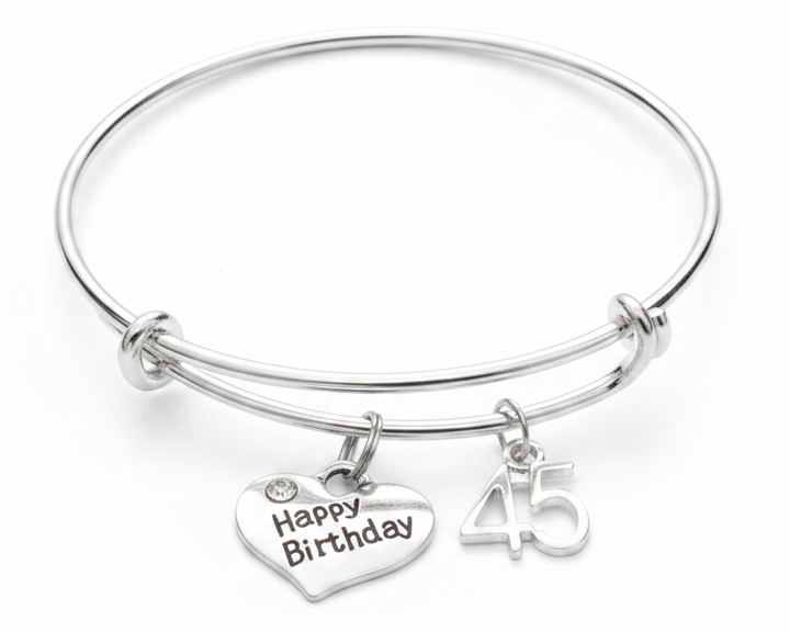 Silver expandable 45th birthday charm bracelet with Happy Birthday heart charm and 45 number charm on white background - Jules Obsession