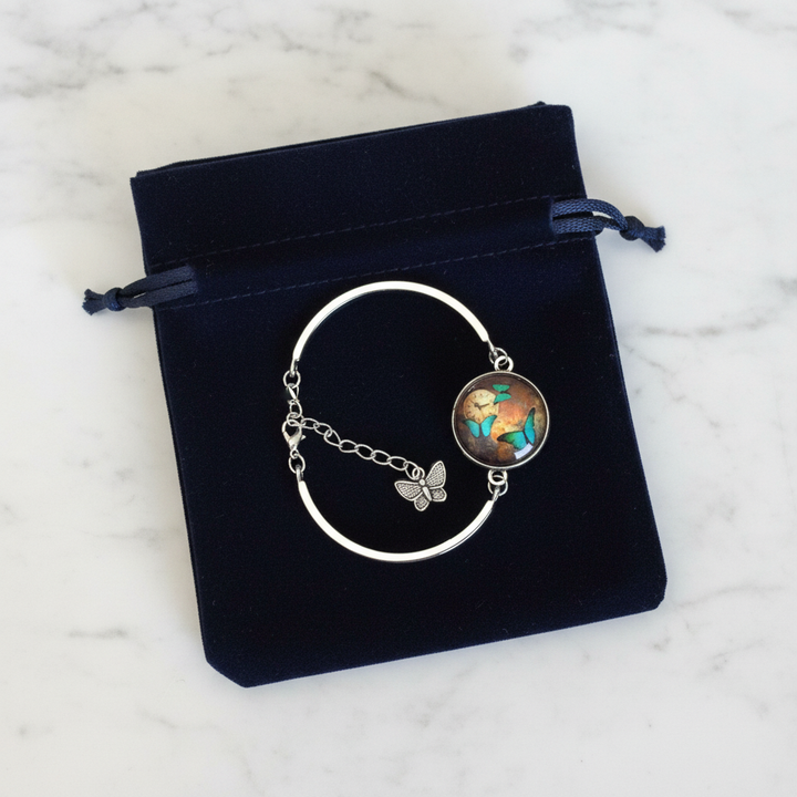 Butterfly and clock glass dome silver cuff bracelet gift-ready in dark velvet jewelry pouch – butterfly lover gift by Jules Obsession