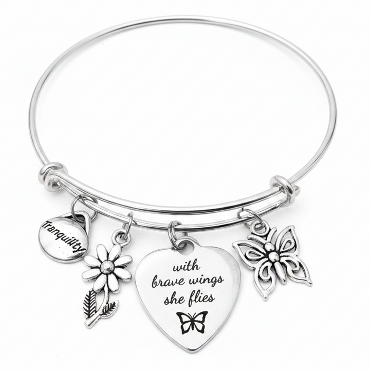 Silver expandable bangle bracelet with Tranquility coin charm, daisy flower charm, engraved heart charm reading &