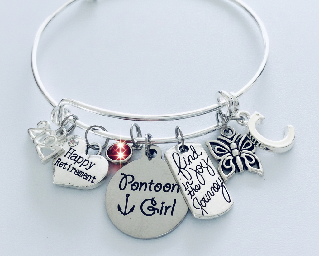 Pontoon Girl Happy Retirement 2026 silver expandable charm bracelet with birthstone, initial, butterfly, and Find Joy in the Journey charms on white background