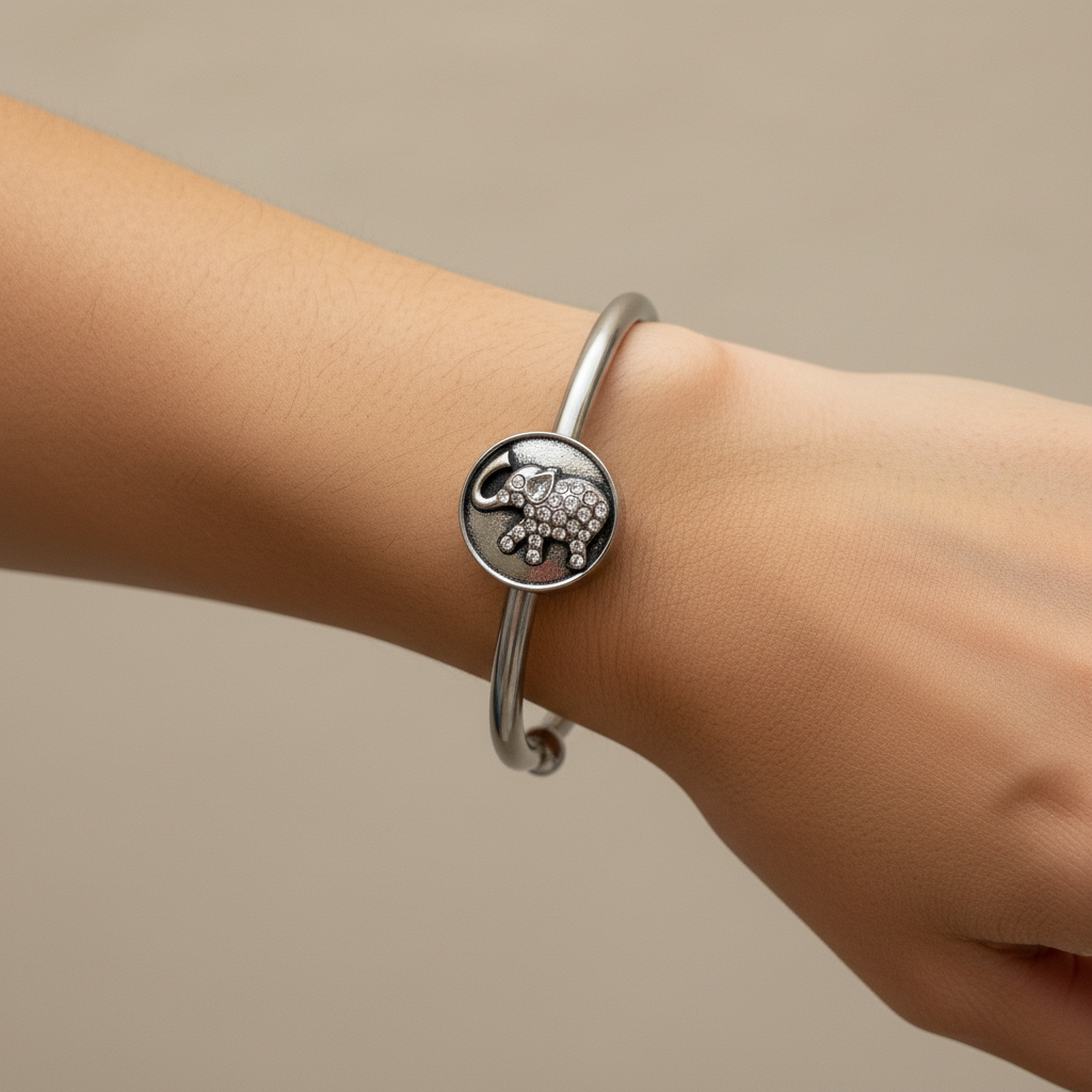 Woman wearing silver elephant snap cuff bracelet with crystal charm – interchangeable 18mm snap bracelet by Jules Obsession