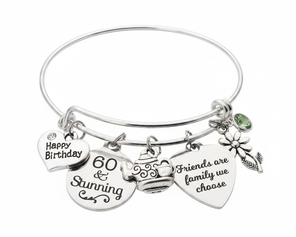 Silver expandable bangle bracelet with Happy Birthday heart charm, 60 and Stunning disc charm, teapot charm, Friends are family we choose heart charm, daisy flower charm, and green birthstone crystal bead on white background - Jules Obsession