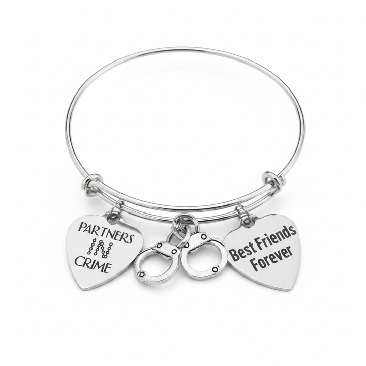 Partners in Crime and Best Friends Forever silver expandable bangle bracelet with handcuff charm on white background – Jules Obsession
