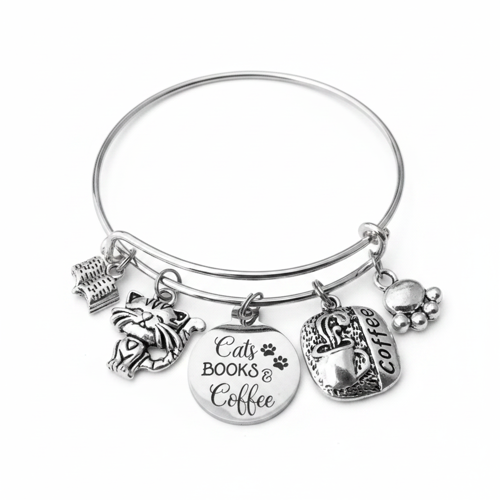 Silver expandable bangle bracelet with five charms: cat face, stack of books, engraved Cats Books &amp; Coffee disc with paw prints, coffee cup, and paw print charm — adjustable stackable gift bracelet for cat lovers and book lovers