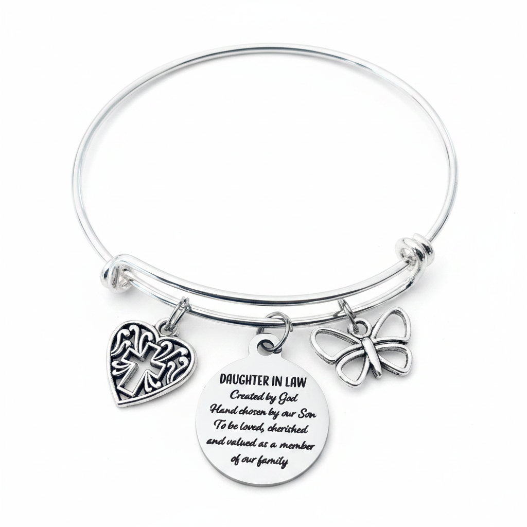 Silver expandable bangle bracelet with three charms: filigree heart with cross cutout, engraved Daughter in Law sentiment disc, and butterfly charm — displayed on a white background