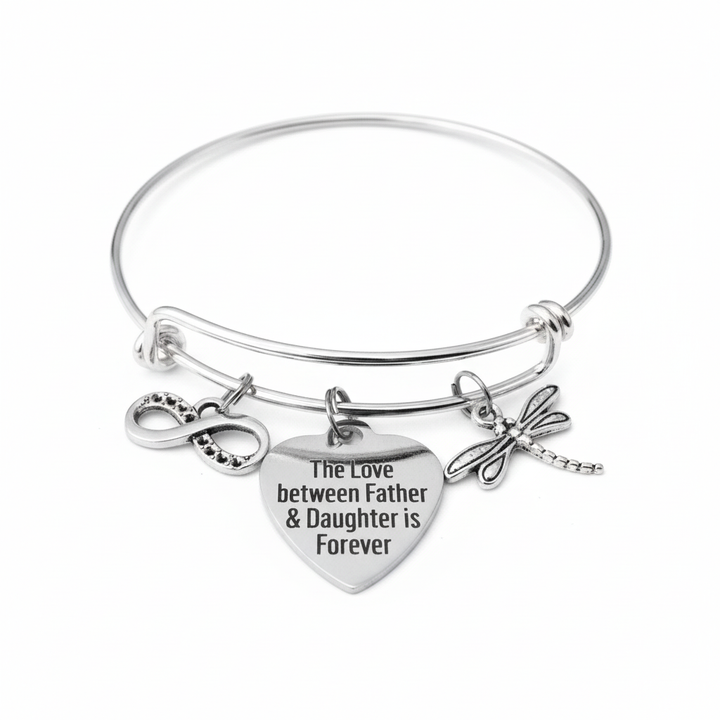 Silver expandable bangle bracelet with plain silver infinity charm, engraved Father and Daughter is Forever heart charm, and dragonfly charm on white background