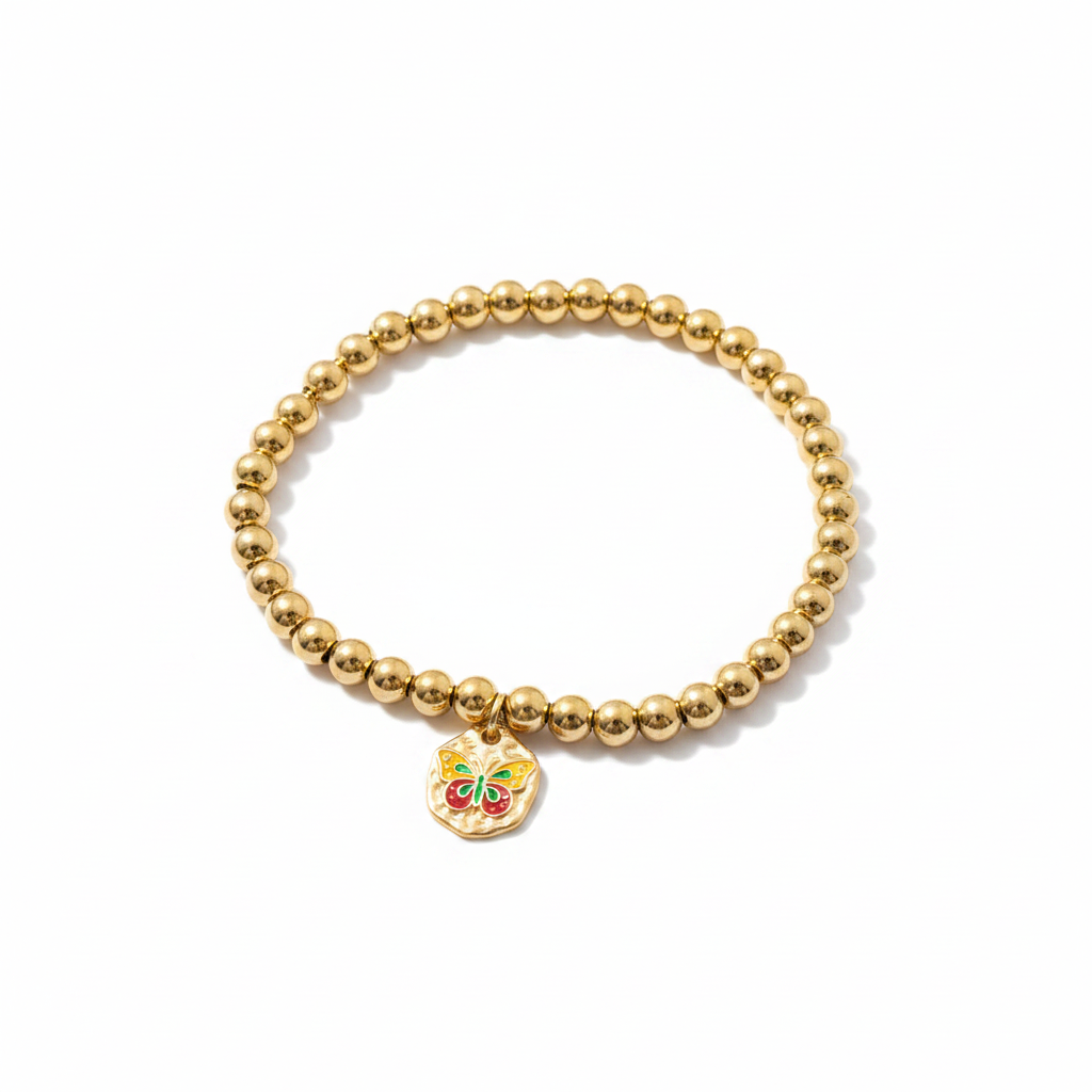 Gold bead stretch bracelet with colorful enamel butterfly hammered disc charm on white background – butterfly jewelry by Jules Obsession