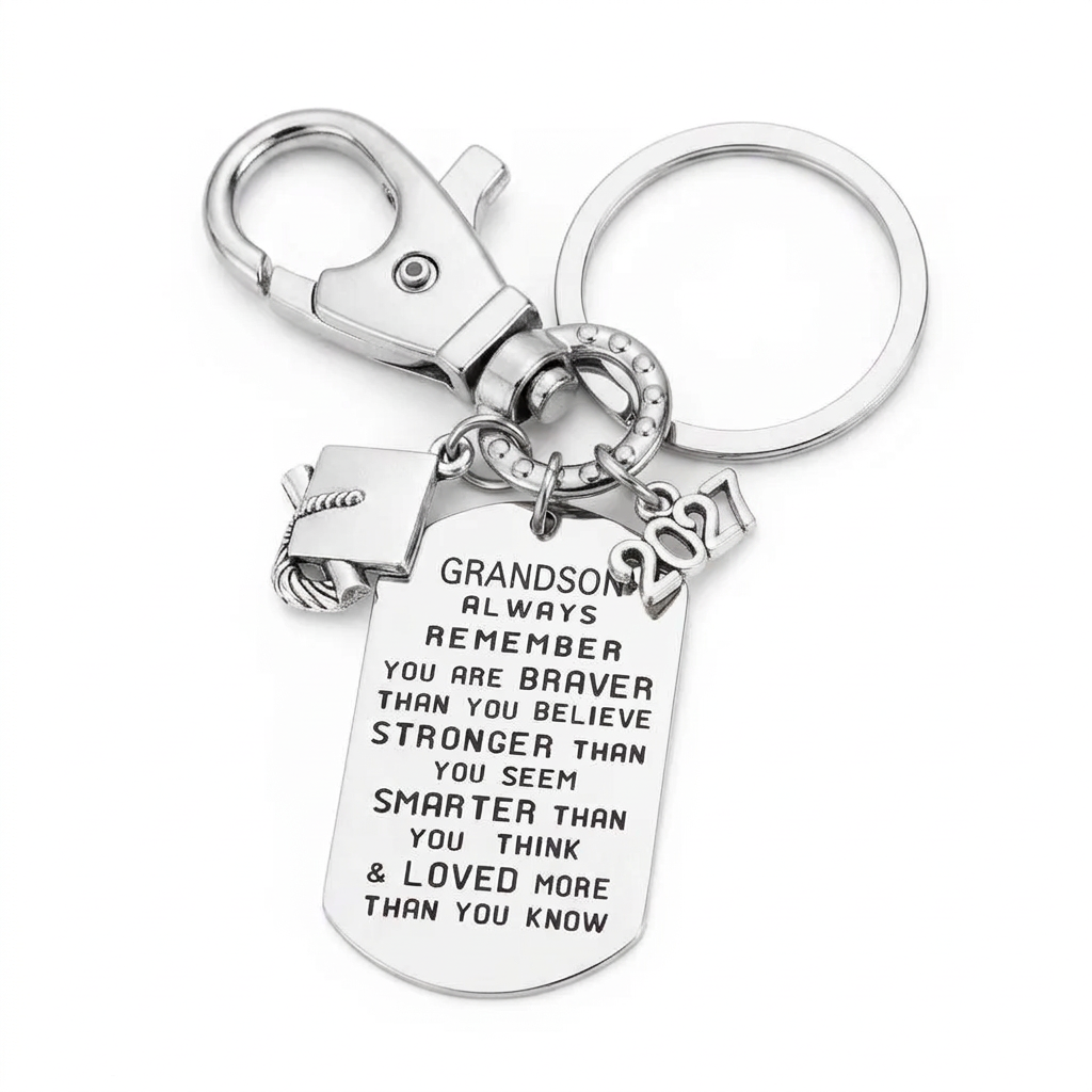 Silver-tone grandson graduation keychain with an inspirational engraved dog tag, graduation cap charm, 2027 year charm, key ring and lobster clasp.
