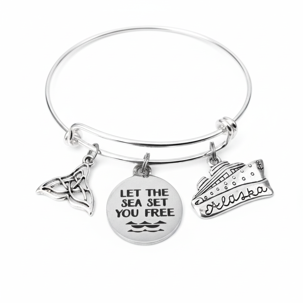 Alaska cruise charm bracelet with whale tail, Let the Sea Set You Free disc and Alaska cruise ship charms on silver expandable bangle by Jules Obsession