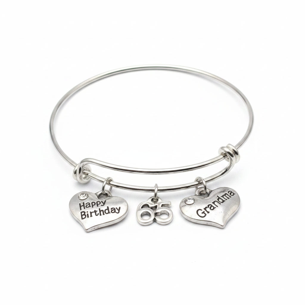 Professional studio photo of silver charm bangle bracelet with Happy Birthday heart, 65 number, and Grandma heart charms on white background