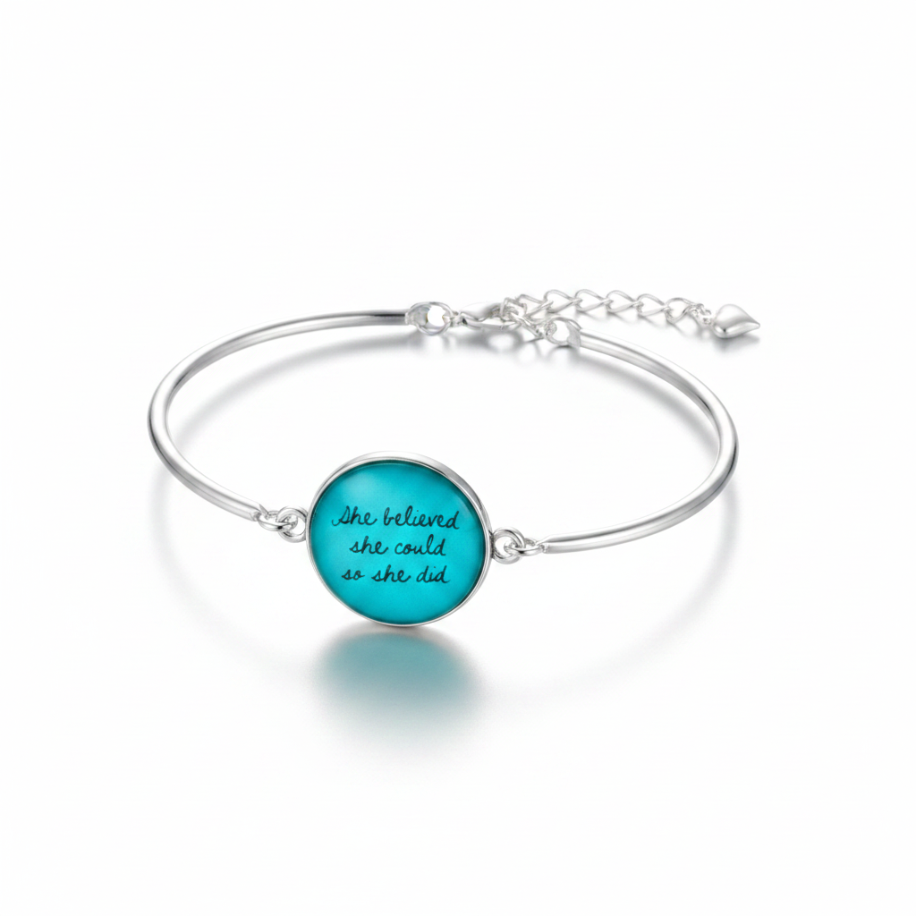 She Believed She Could So She Did silver cuff bangle bracelet with teal glass dome cabochon and heart charm on white background – Jules Obsession