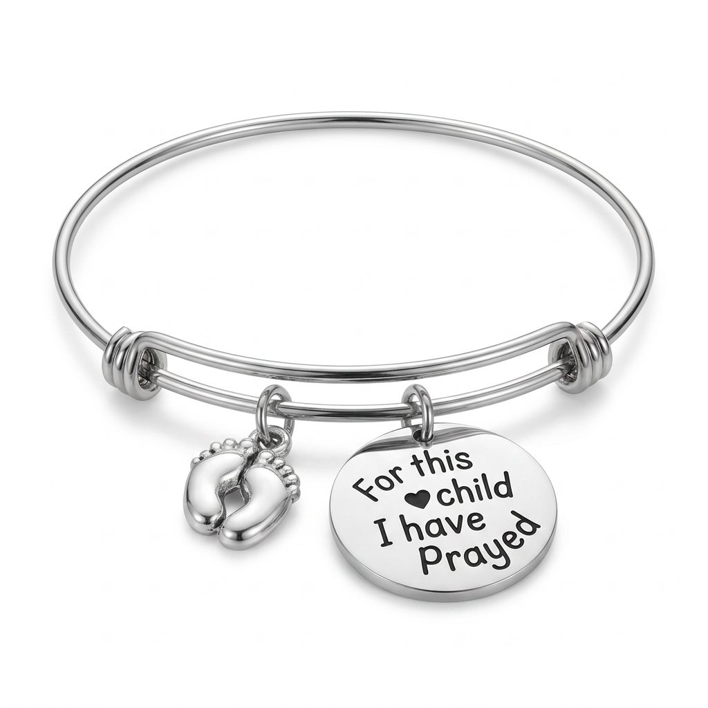 Stainless steel expandable bangle with silver-plated baby feet and round For This Child I Have Prayed charms on a white background.