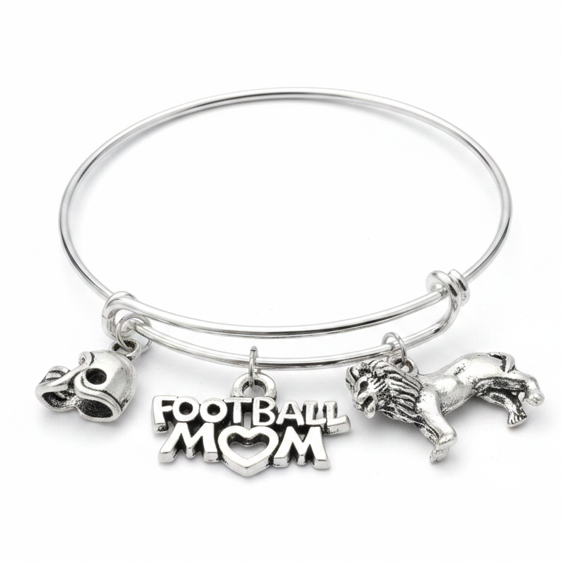 Silver expandable bangle bracelet with football helmet charm, Football Mom heart charm, and lion player charm on white studio background