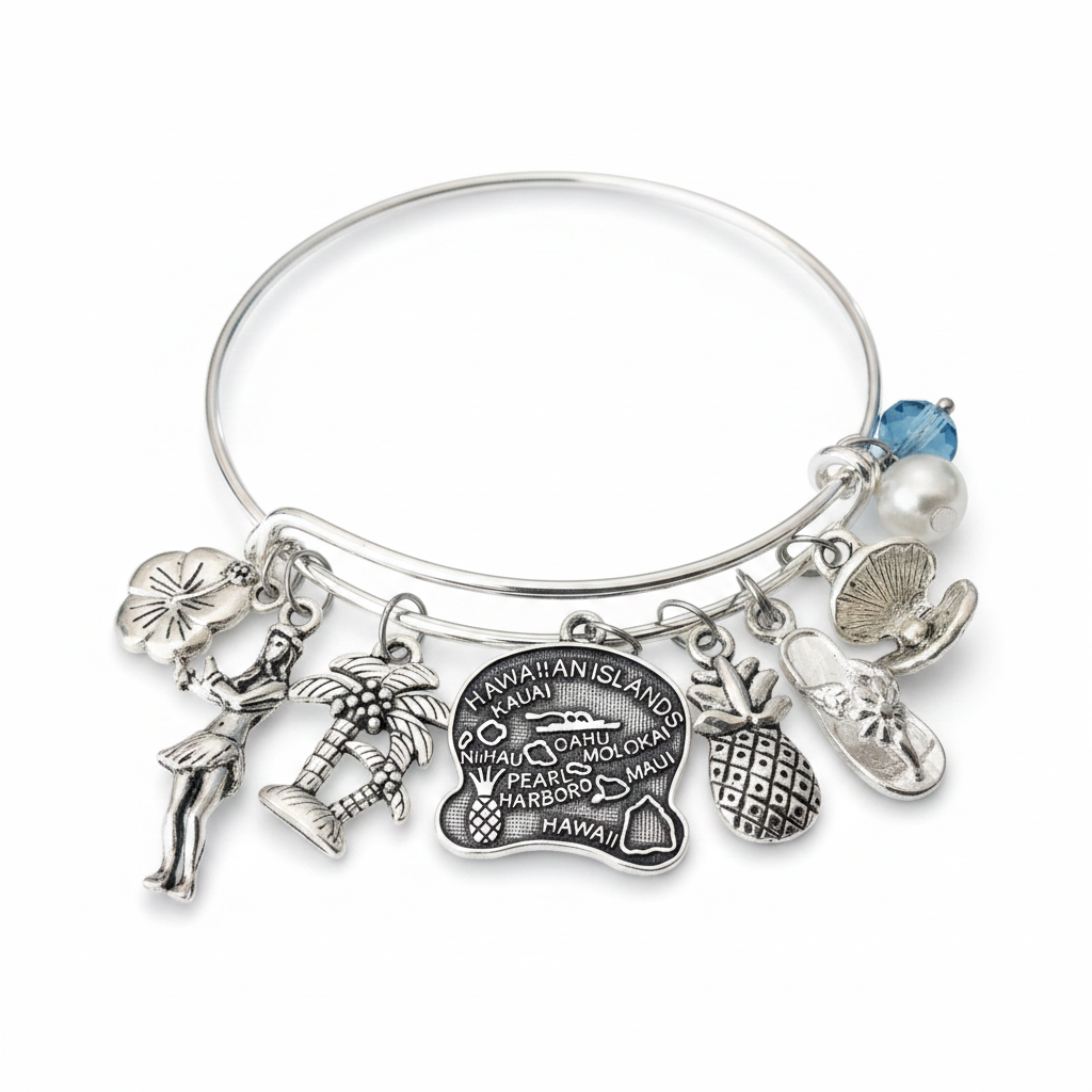 Silver expandable bangle bracelet with 8 Hawaii charms including hibiscus, hula dancer, palm tree, Hawaiian Islands map disc, pineapple, flip flop, pearl bead, and blue crystal bead on white background – Jules Obsession