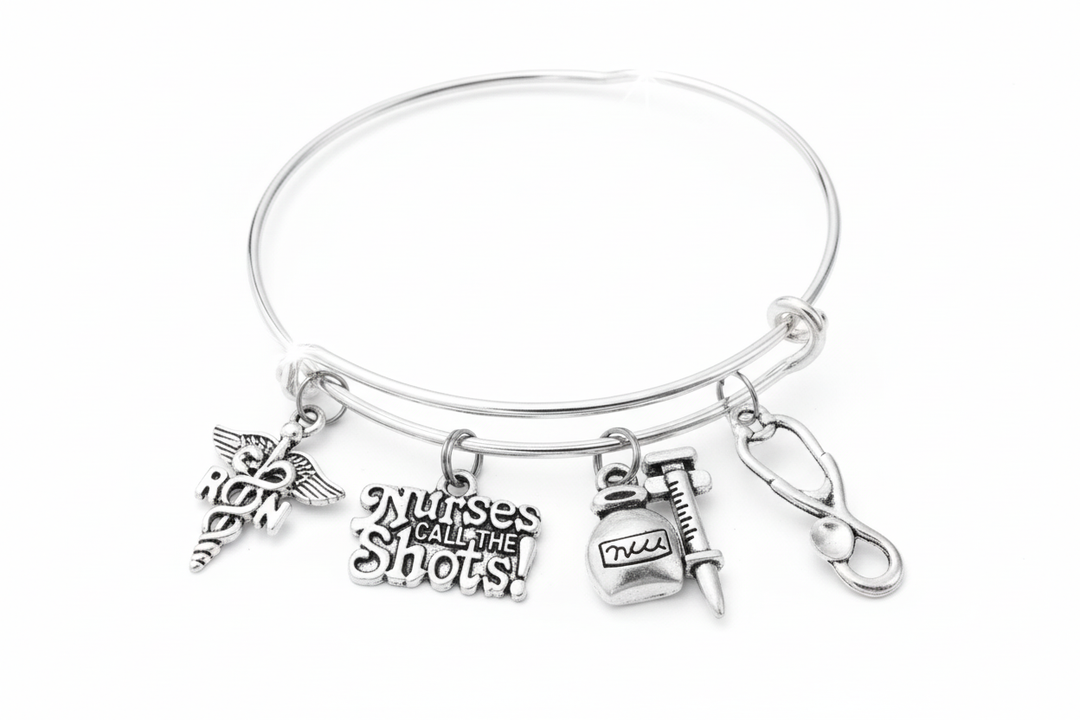 Nurses Call the Shots RN expandable charm bracelet with medical charms on white background