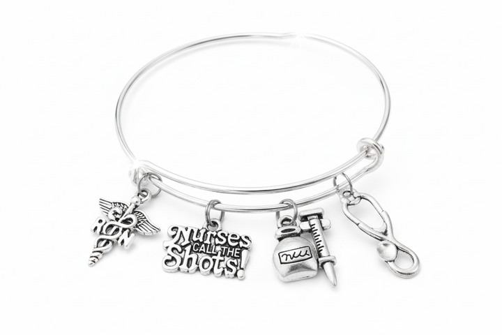 Nurses Call the Shots RN expandable charm bracelet with medical charms on white background