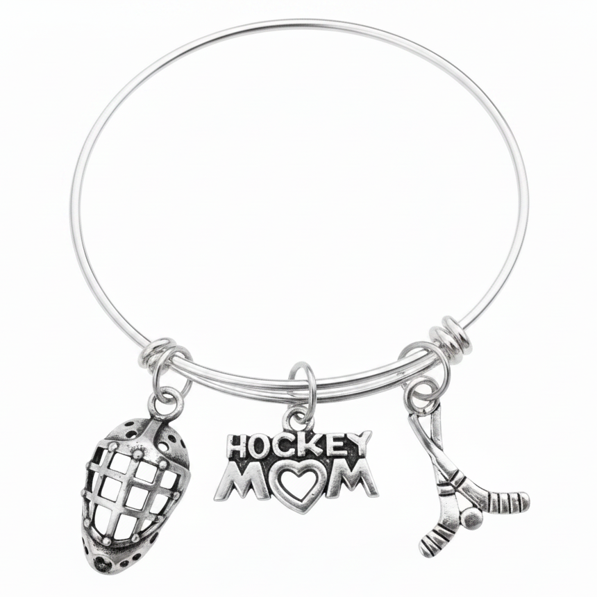 Silver expandable wire bangle bracelet with three hockey charms each attached via individual jump rings: goalie mask charm, Hockey Mom heart charm, and crossed hockey sticks with puck charm, on white background