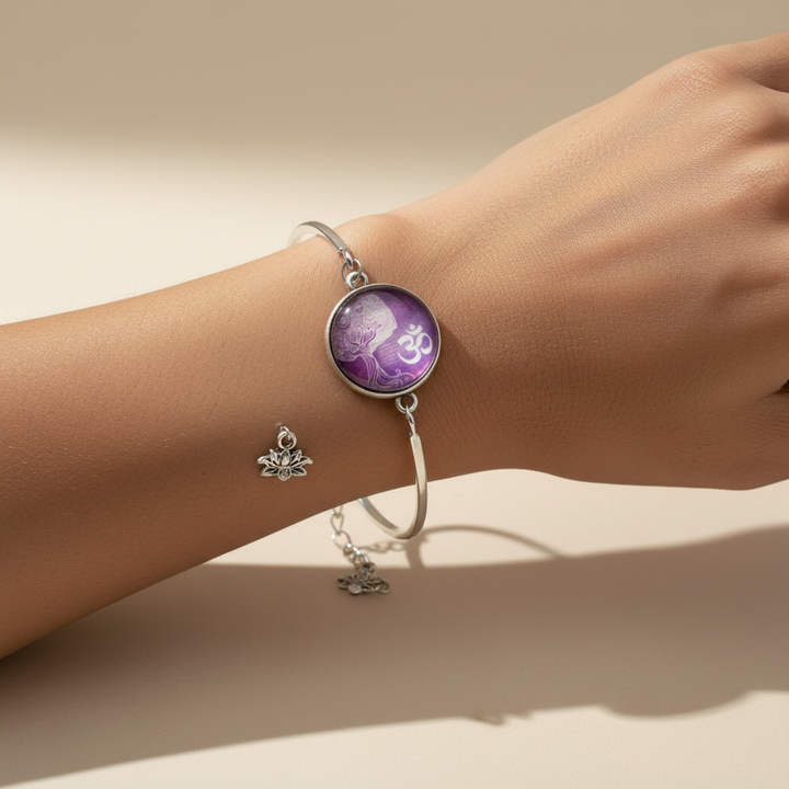 Woman wearing purple Tree of Life Om glass dome silver bangle bracelet with lotus charm – yoga spiritual jewelry by Jules Obsession