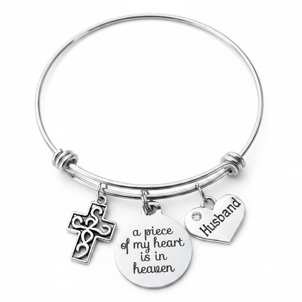 Silver husband memorial charm bracelet with filigree cross, a piece of my heart is in heaven disc charm, and Husband heart charm on expandable wire bangle