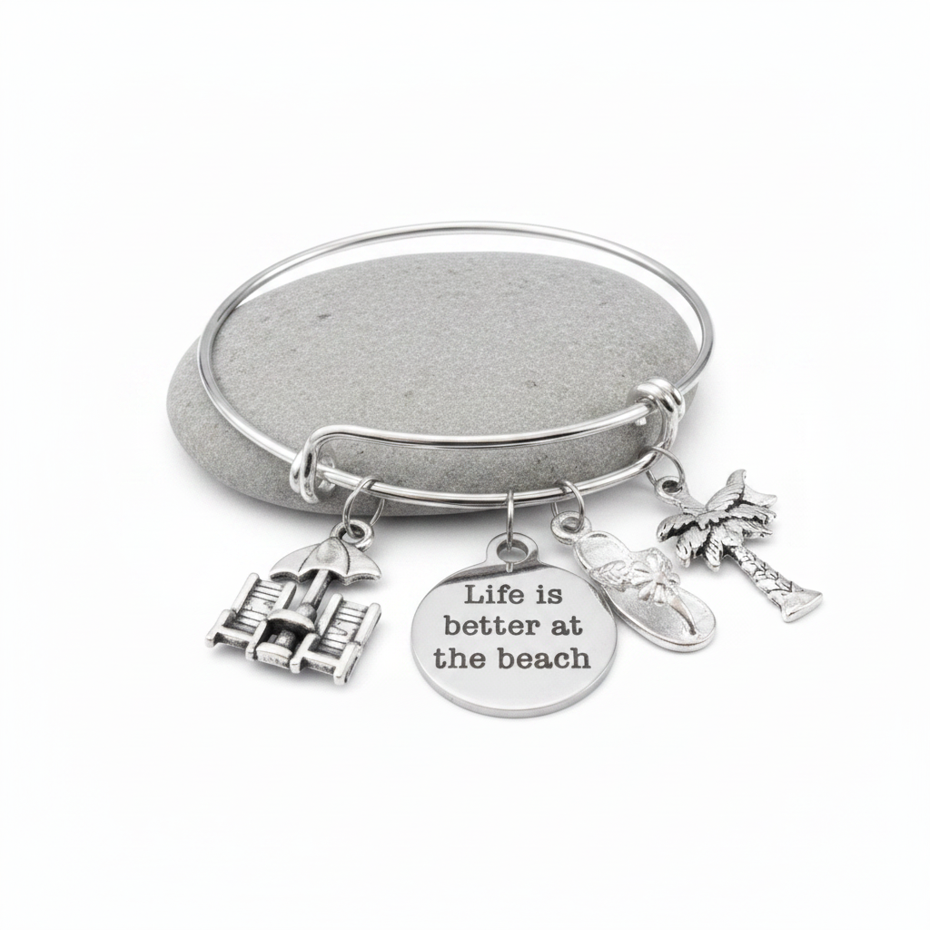 Silver expandable bangle bracelet with four beach-themed charms: beach chairs with umbrella, Life is Better at the Beach engraved disc, flip flop sandal, and palm tree — adjustable stackable gift bracelet for women