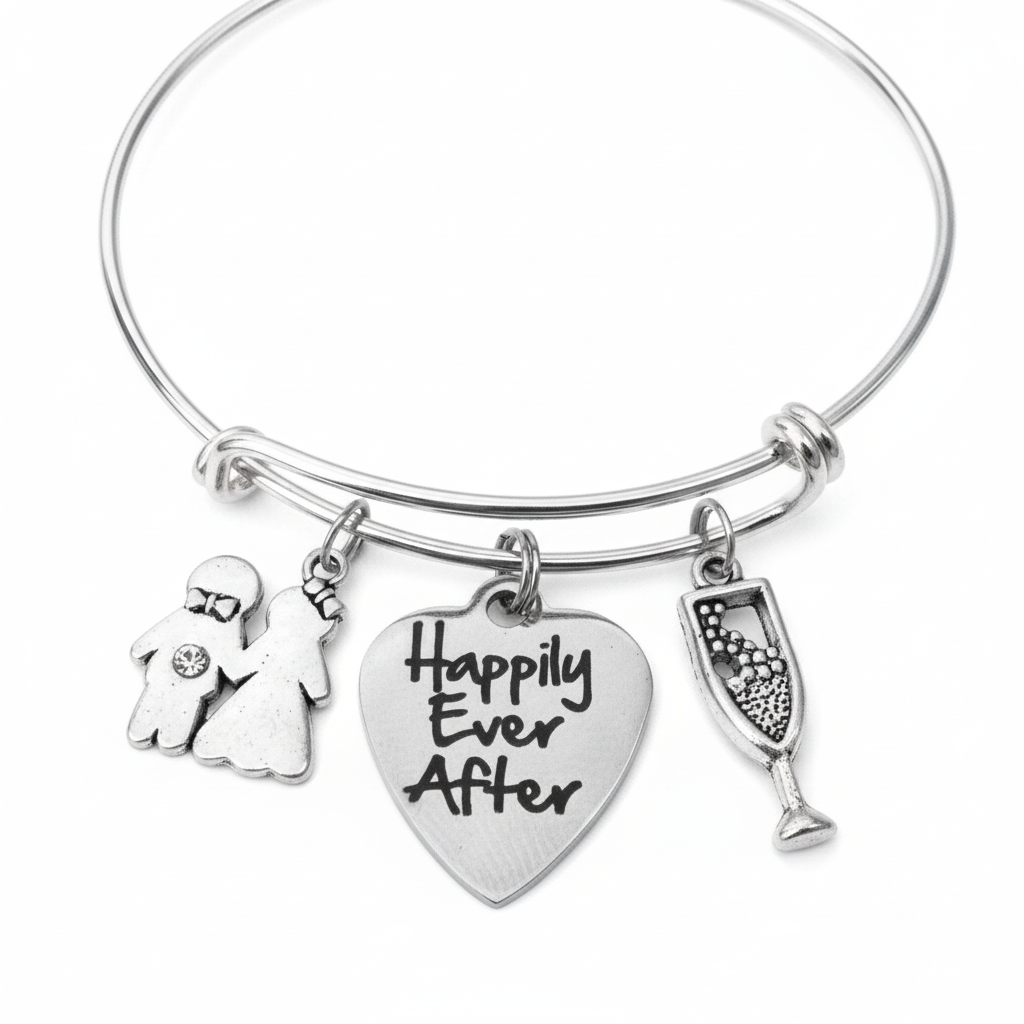 Silver expandable bangle bracelet with Happily Ever After engraved heart charm, bride and groom couple charm with crystal, and champagne flute charm on white background