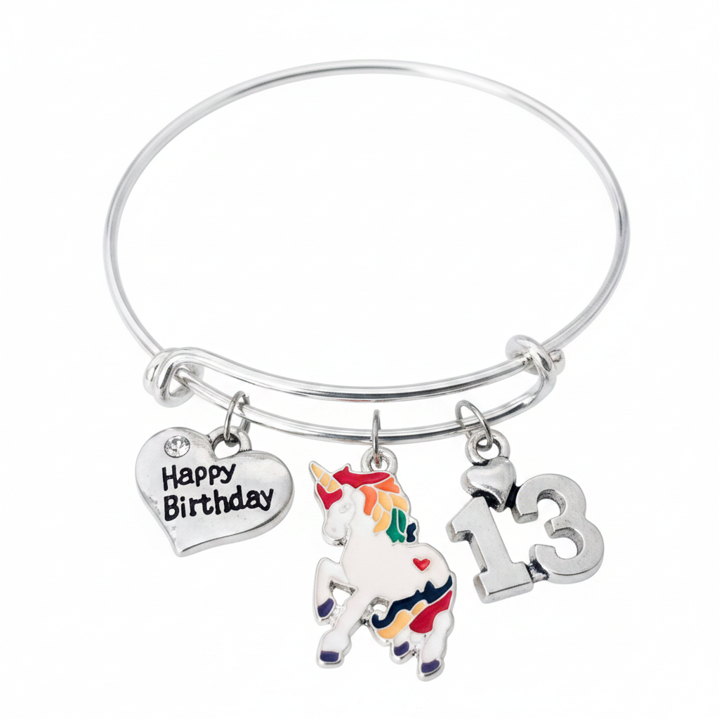 Silver expandable bangle bracelet with three charms: Happy Birthday heart charm with crystal accent, colorful rainbow unicorn enamel charm with pink orange yellow green mane and red heart, and silver number 13 charm with tiny heart — adjustable stackable 13th birthday gift bracelet for teen girls