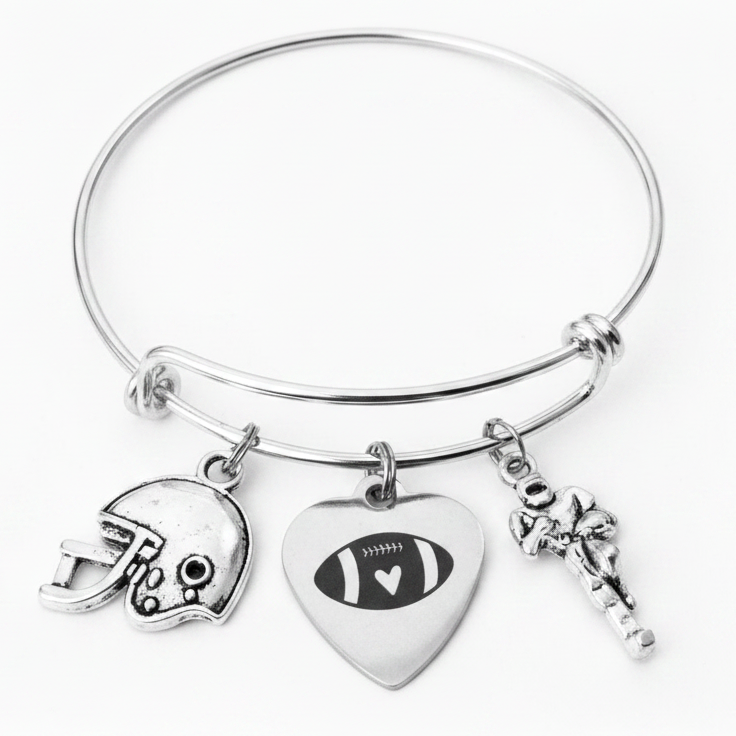 Silver expandable bangle bracelet with three football-themed charms: football helmet, heart-shaped football charm, and Football Player charm on white background