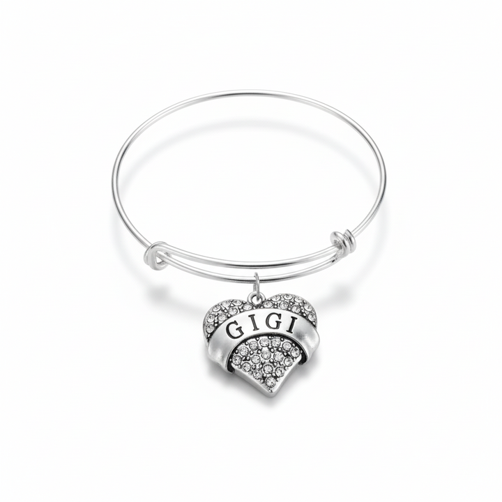 Silver expandable wire bangle bracelet with sparkling crystal rhinestone pave GIGI heart charm on white background – Jules Obsession
