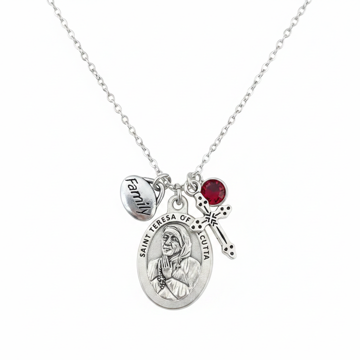 Saint Teresa of Calcutta silver charm necklace with oval saint medal, Family charm, red crystal birthstone, and decorative cross on stainless steel chain