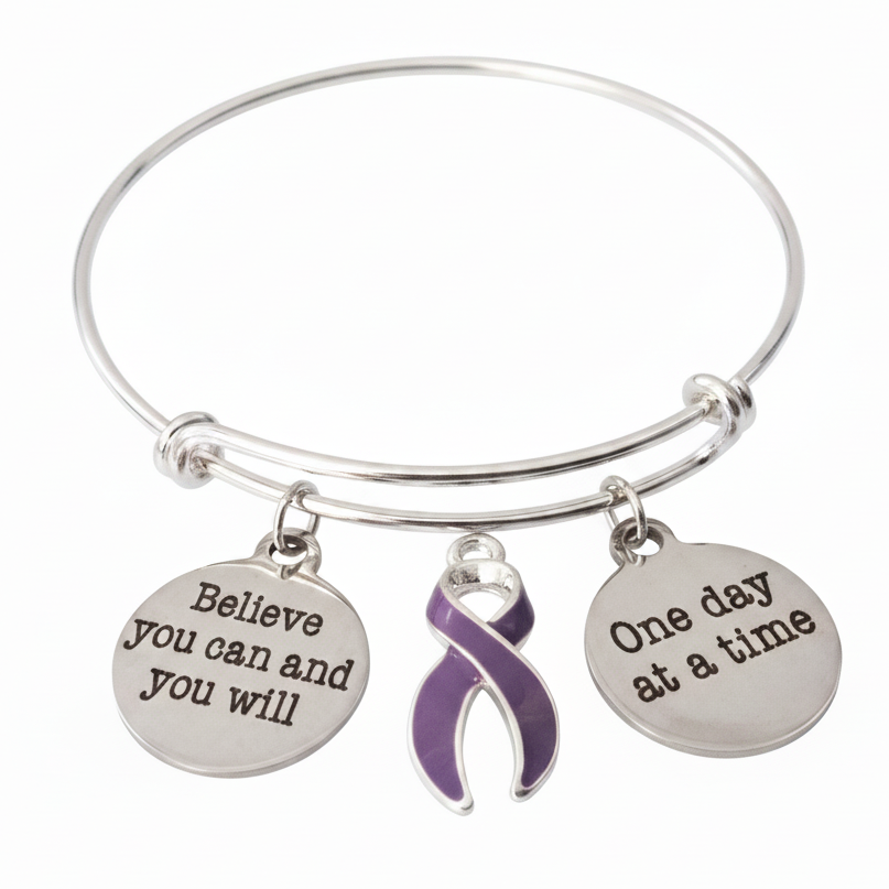 Silver expandable bangle bracelet with Believe You Can and You Will disc charm, purple enamel awareness ribbon charm, and One Day at a Time disc charm on white background - Jules Obsession