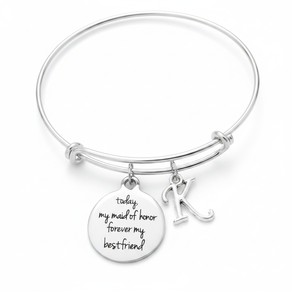 A silver wire expandable bracelet with a round engraved disc charm reading 'today my maid of honor forever my best friend' and a hanging initial