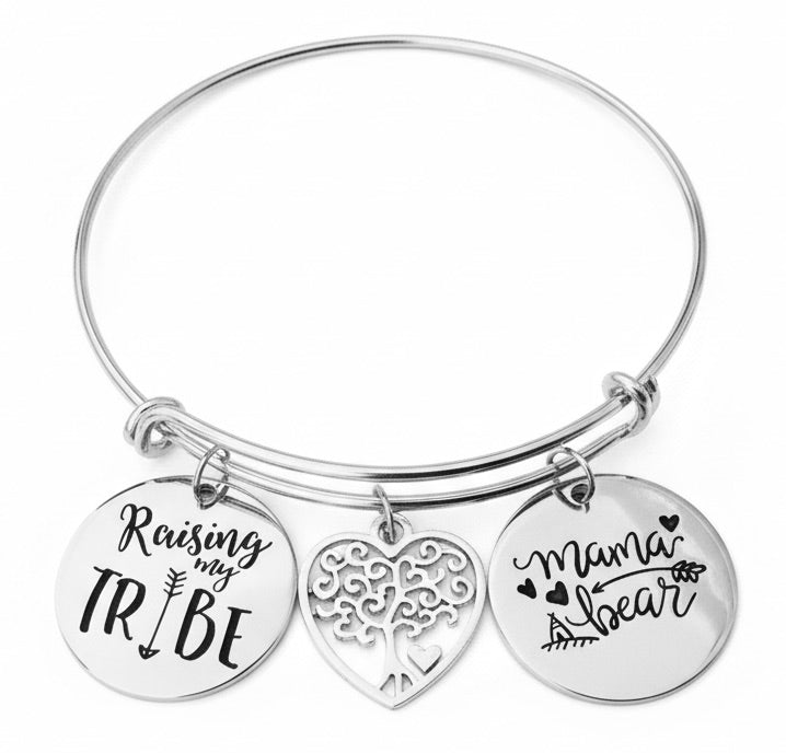 Silver expandable charm bangle bracelet with Raising My Tribe engraved disc charm, filigree tree of life heart charm, and Mama Bear engraved disc charm — meaningful mom and family gift bracelet by Jules Obsession