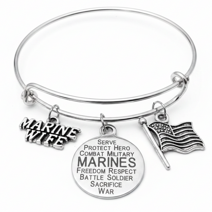 Marine Wife expandable silver charm bracelet featuring a Marine Wife text charm, Marines engraved word disc, and USA flag charm on a black background