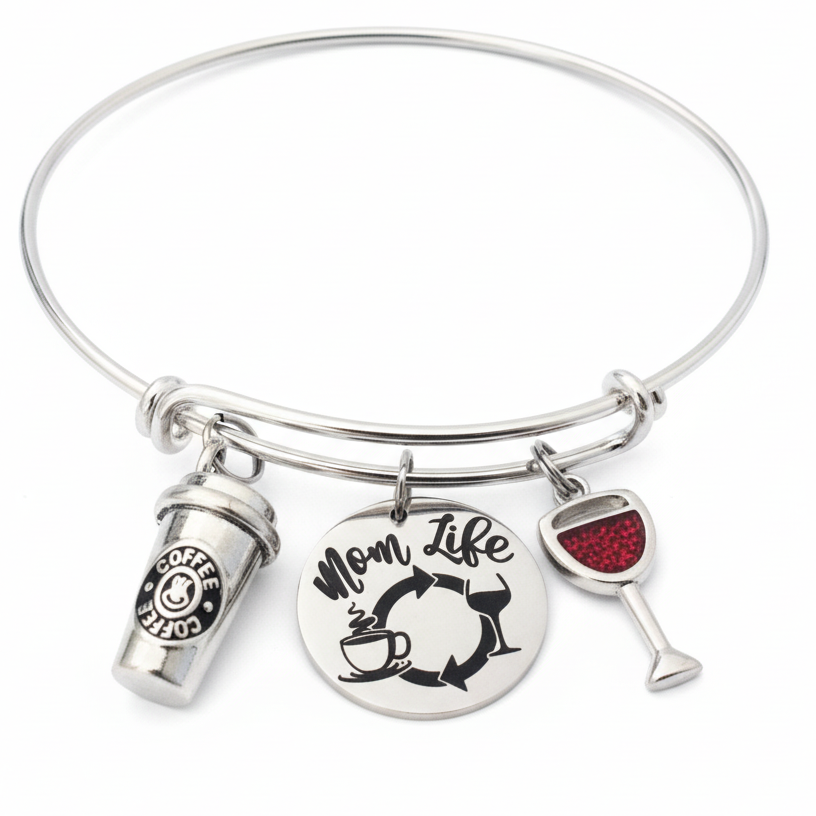 Silver expandable charm bangle bracelet with coffee to-go cup charm, engraved Mom Life disc showing coffee-to-wine cycle, and red crystal wine glass charm — funny Mother's Day gift for moms by Jules Obsession