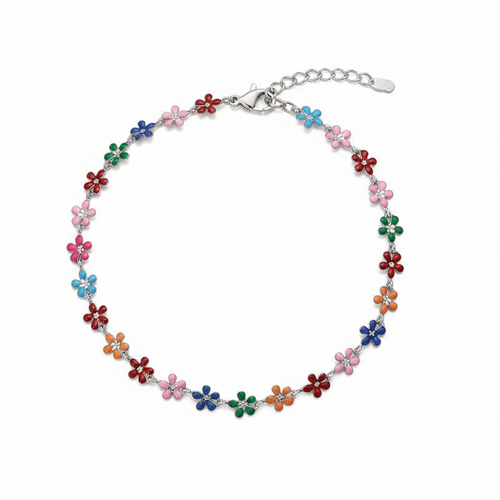 Delicate silver-tone chain anklet featuring a continuous row of multicolor enamel daisy flowers in pink, blue, green, orange, red, and purple, with a lobster clasp and adjustable extender chain — displayed on a white background