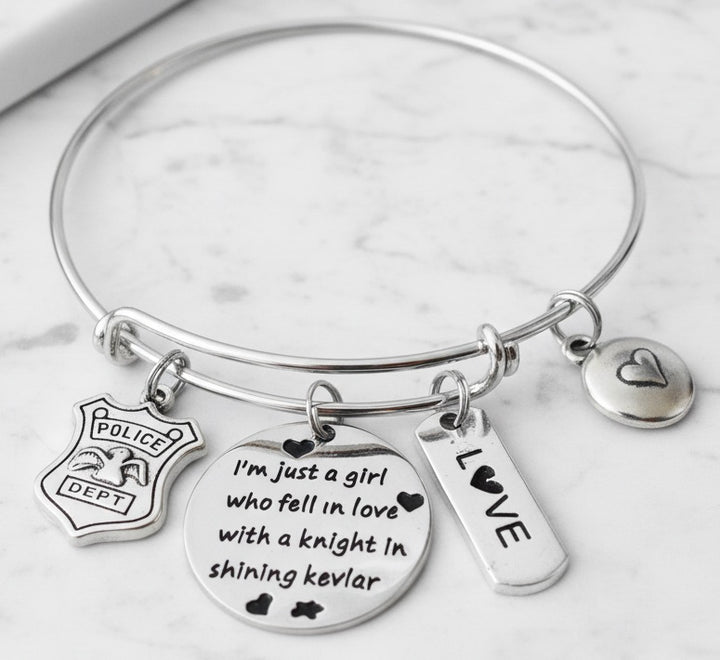 Silver expandable bangle bracelet with police badge charm, round disc engraved &